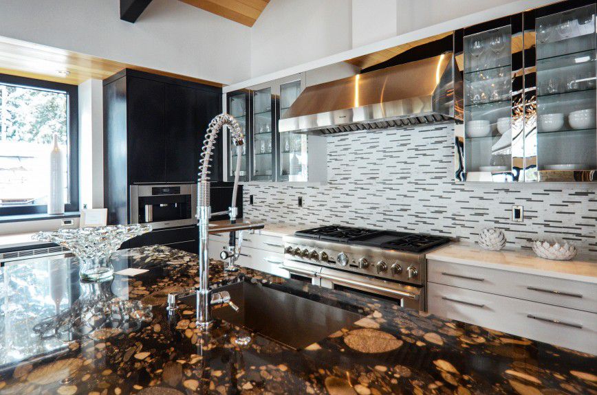 aspen-interior-design - Polished chrome cabinets in a mountain modern kitchen designed by Runa Novak of In Your Space Interior Design - InYourSpaceHome.com and RunaNovak.com